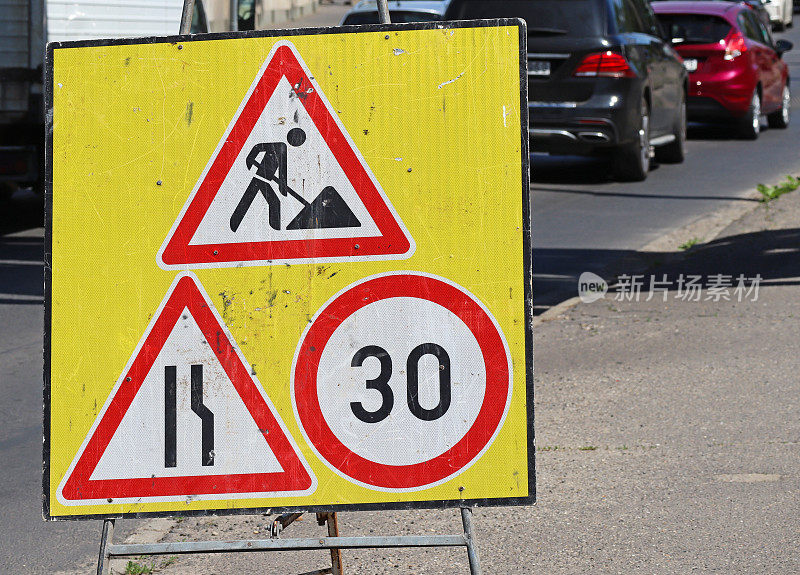 Traffic signs at the road construction site